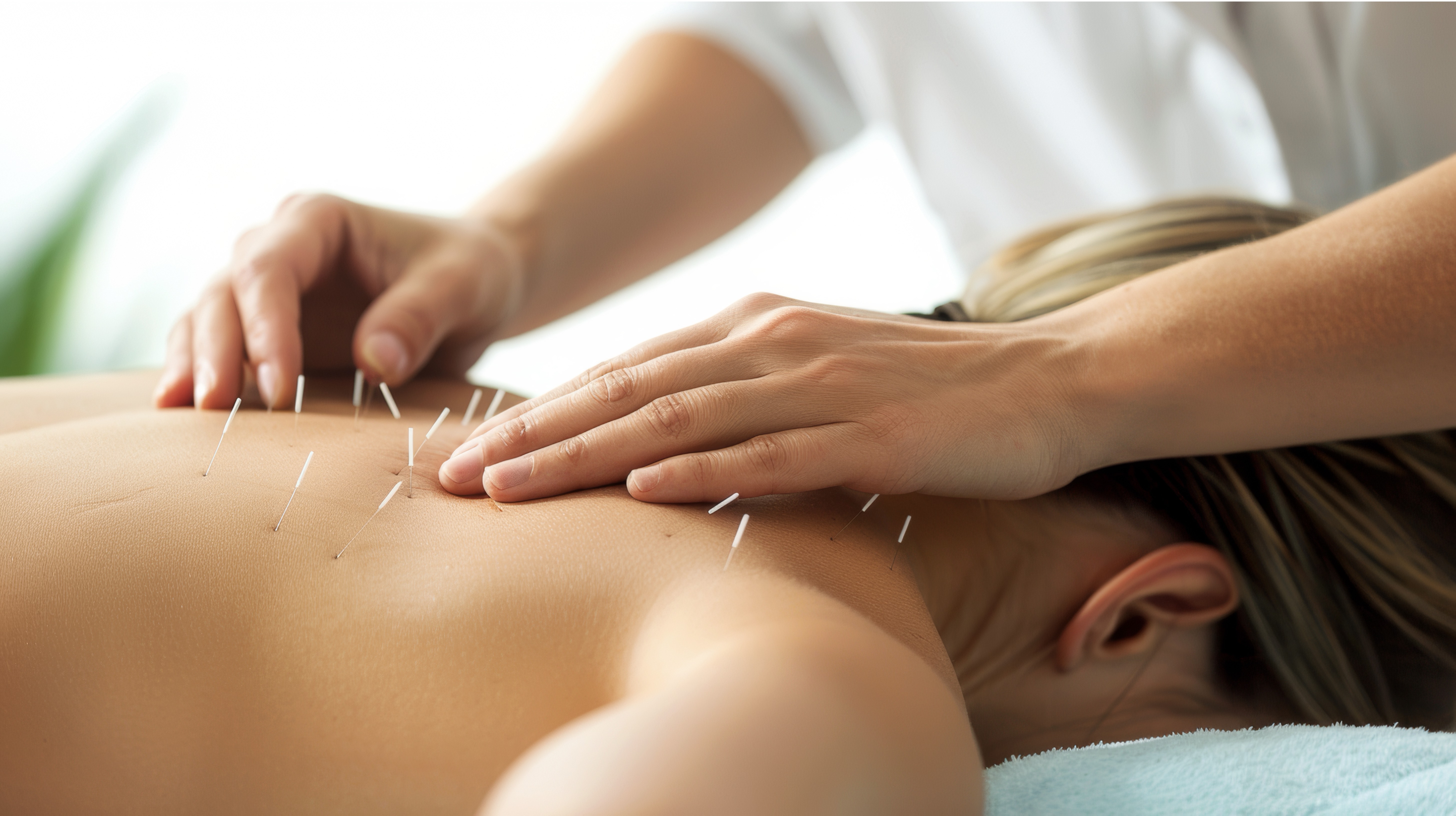 man is adjusting womans back with womans hand